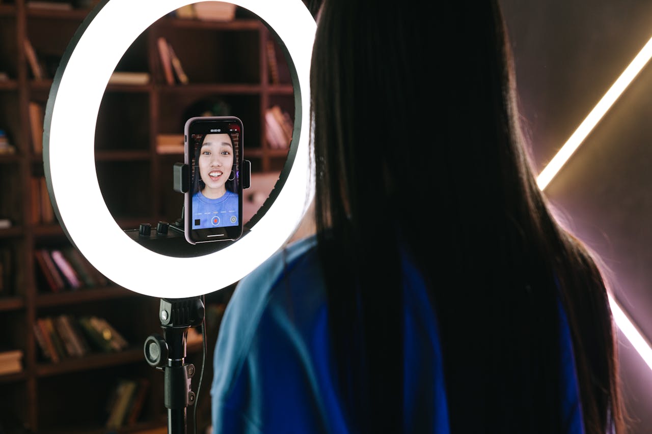 A Woman Recording Herself with a Smartphone